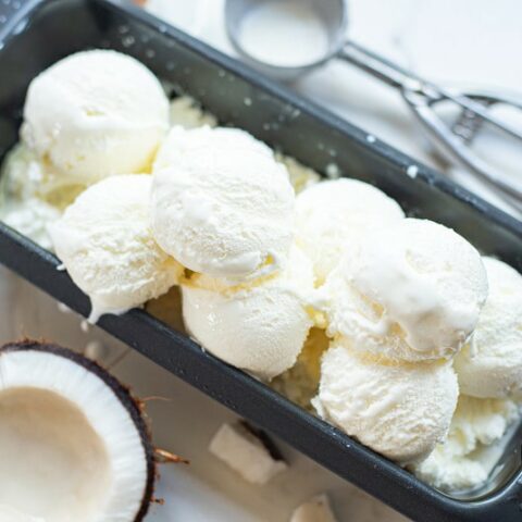 scoops of coconut sorbet in a metal pan