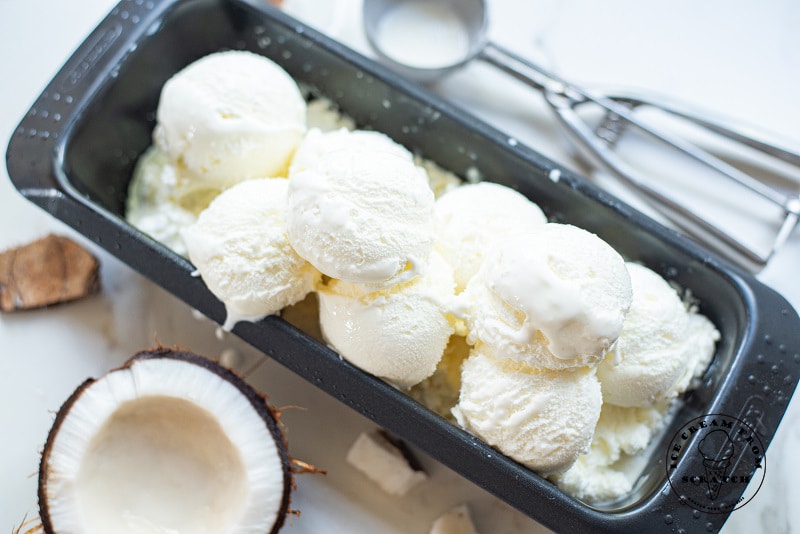 scoops of coconut sorbet in a metal pan