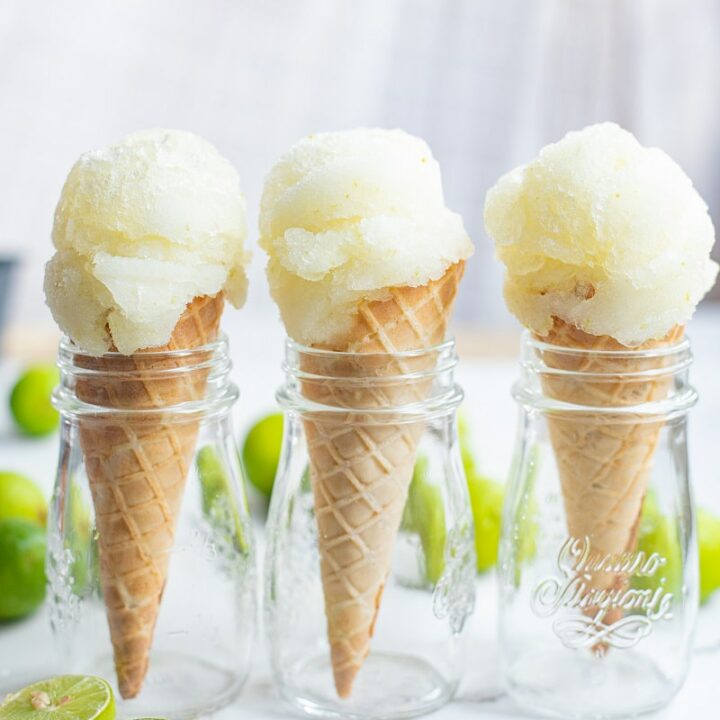 three ice cream cones with a scoop of lime sorbet