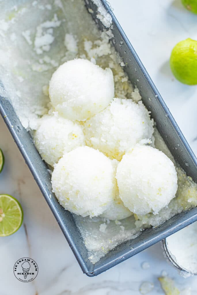 scoops of lime sorbet in a metal pan