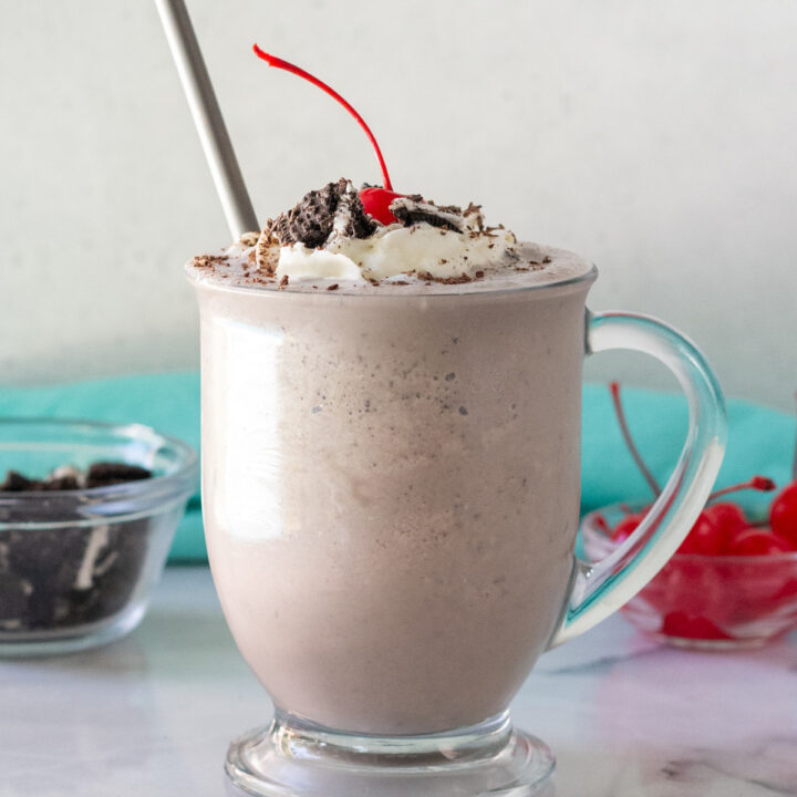 cookies and cream milkshake in a clear glass