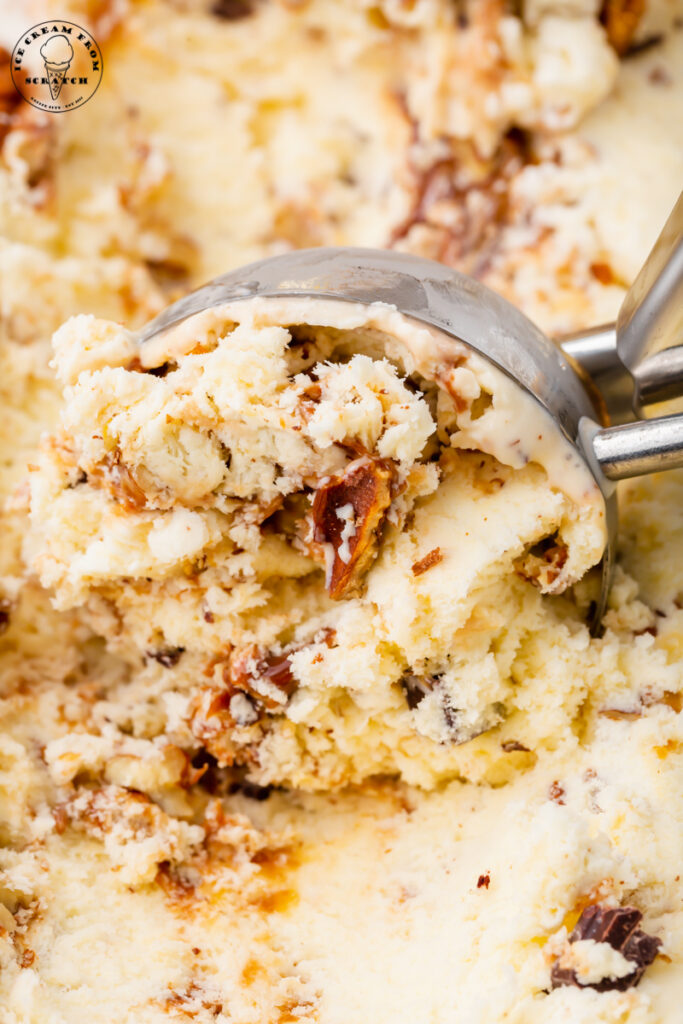 a metal ice cream scoop scooping homemade turtle ice cream.