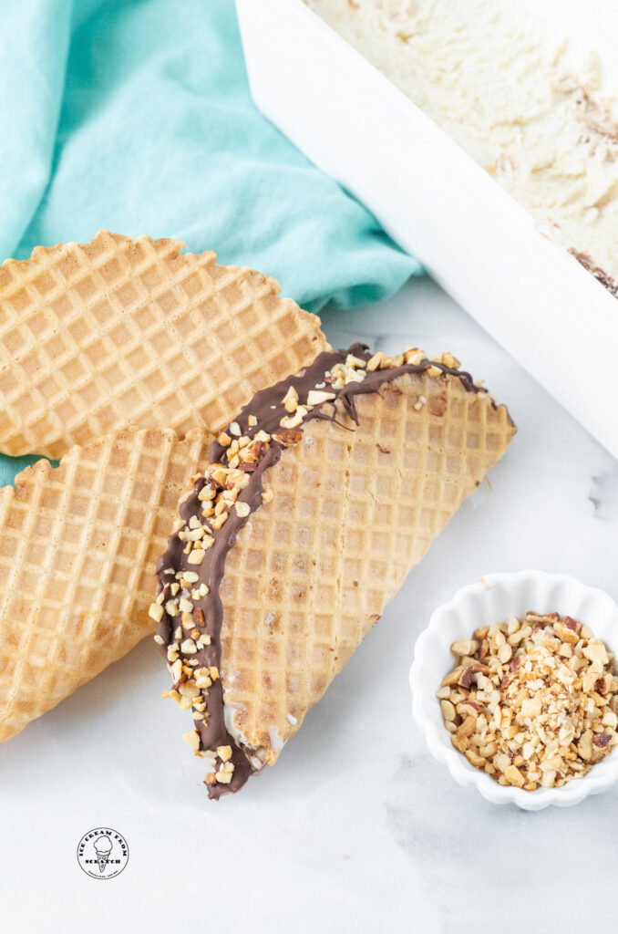 a choco taco leaning on two waffle taco shells