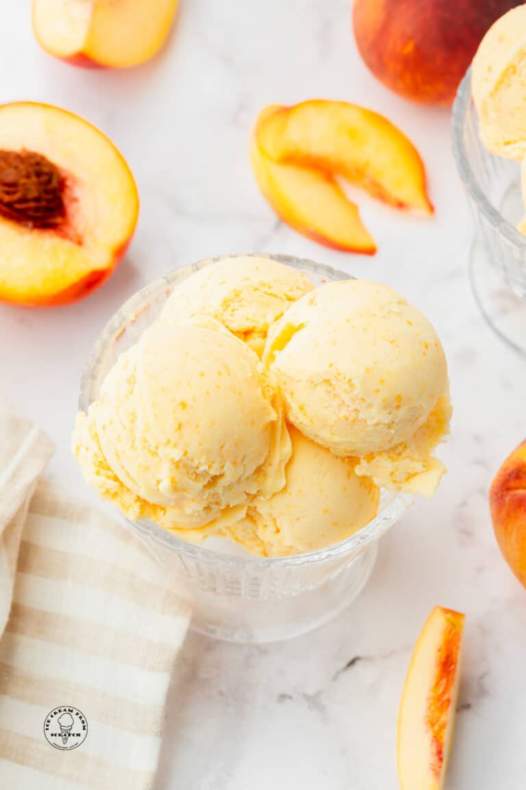 scoops of peaches and cream ice cream in a bowl