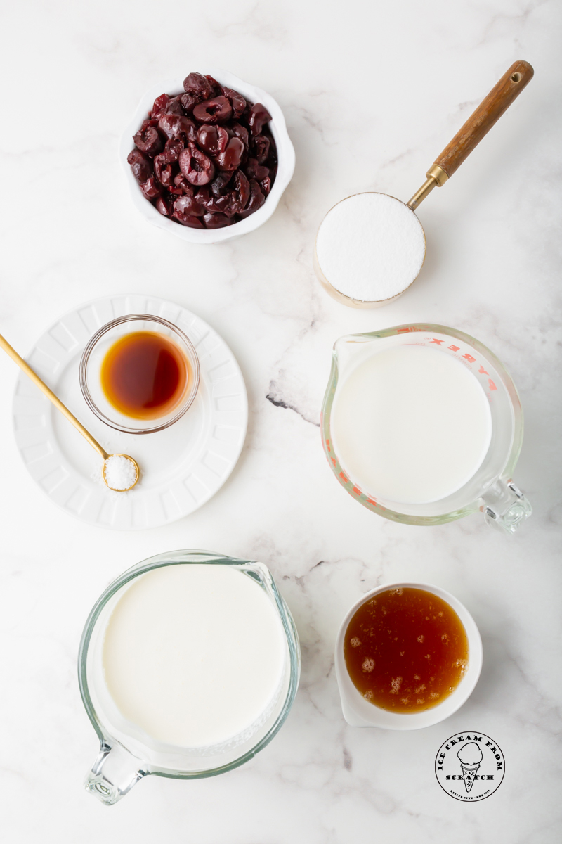 The ingredients needed to make homemade cherry gelato with frozen dark cherries.