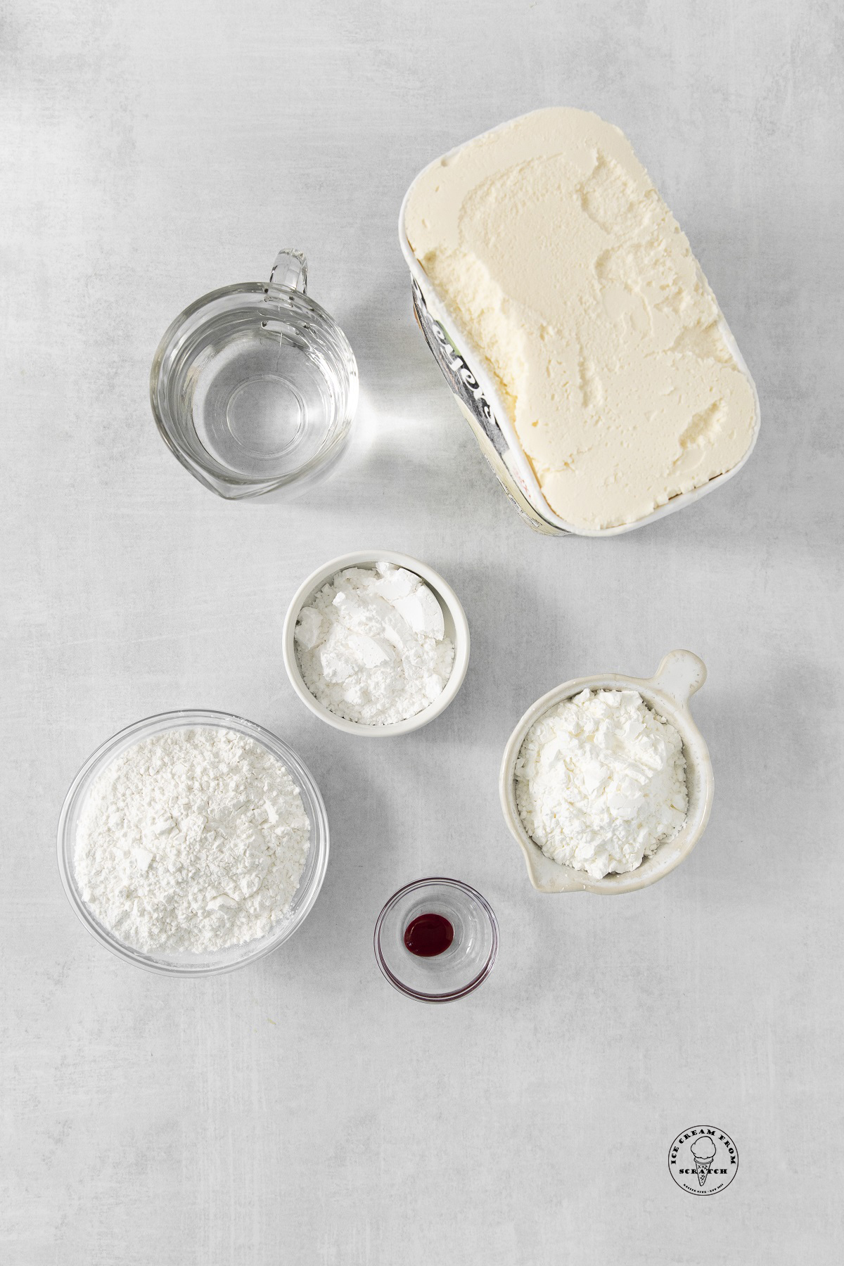 The ingredients needed to make mochi: ice cream, powdered sugar, glutinous rice flour, and food coloring.