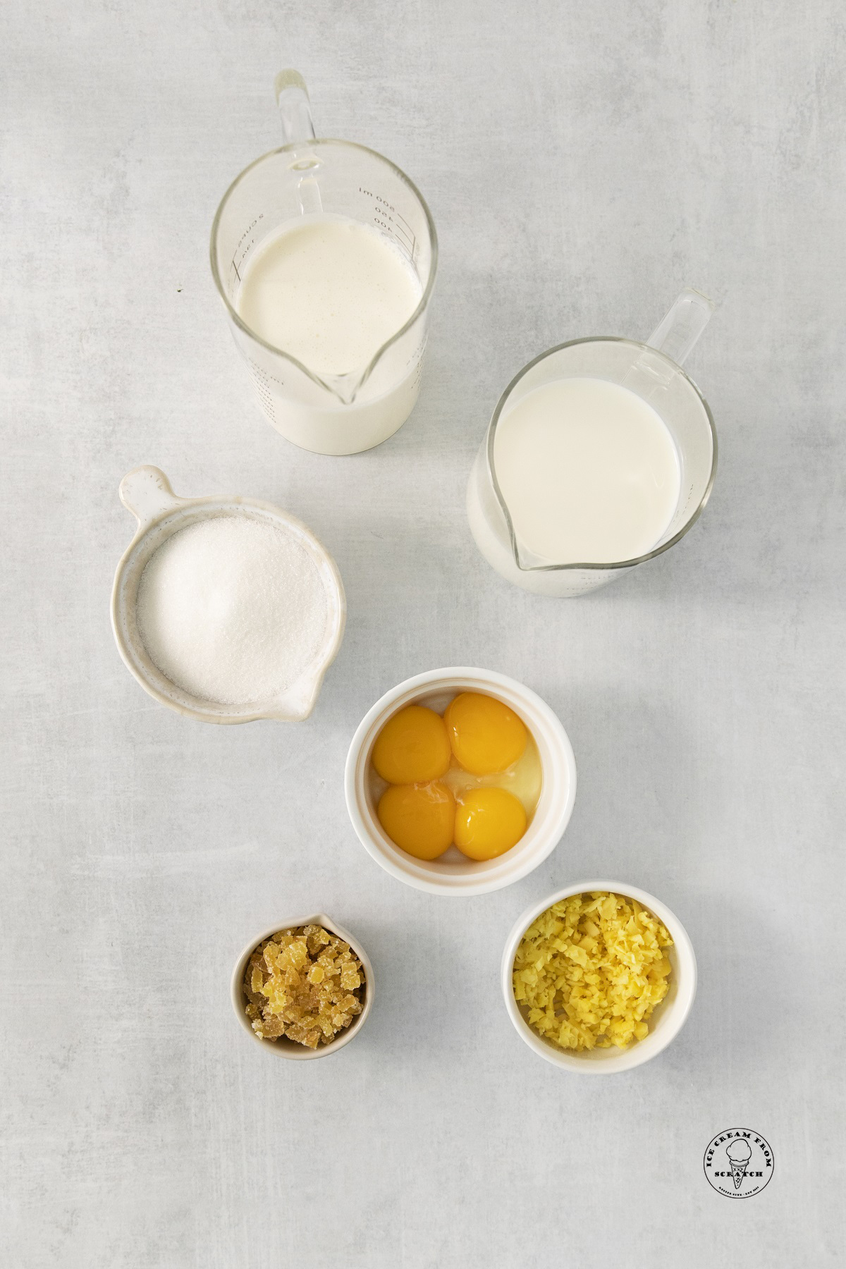 The ingredients in ginger ice cream, including milk and cream, fresh ginger, and candied ginger