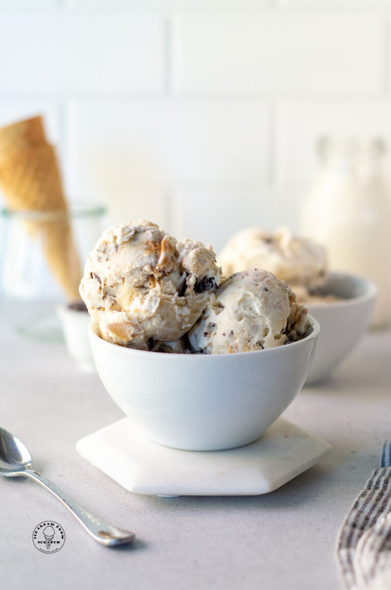 scoops of no churn fat elvis ice cream in a bowl with swirls of peanut butter and banana.