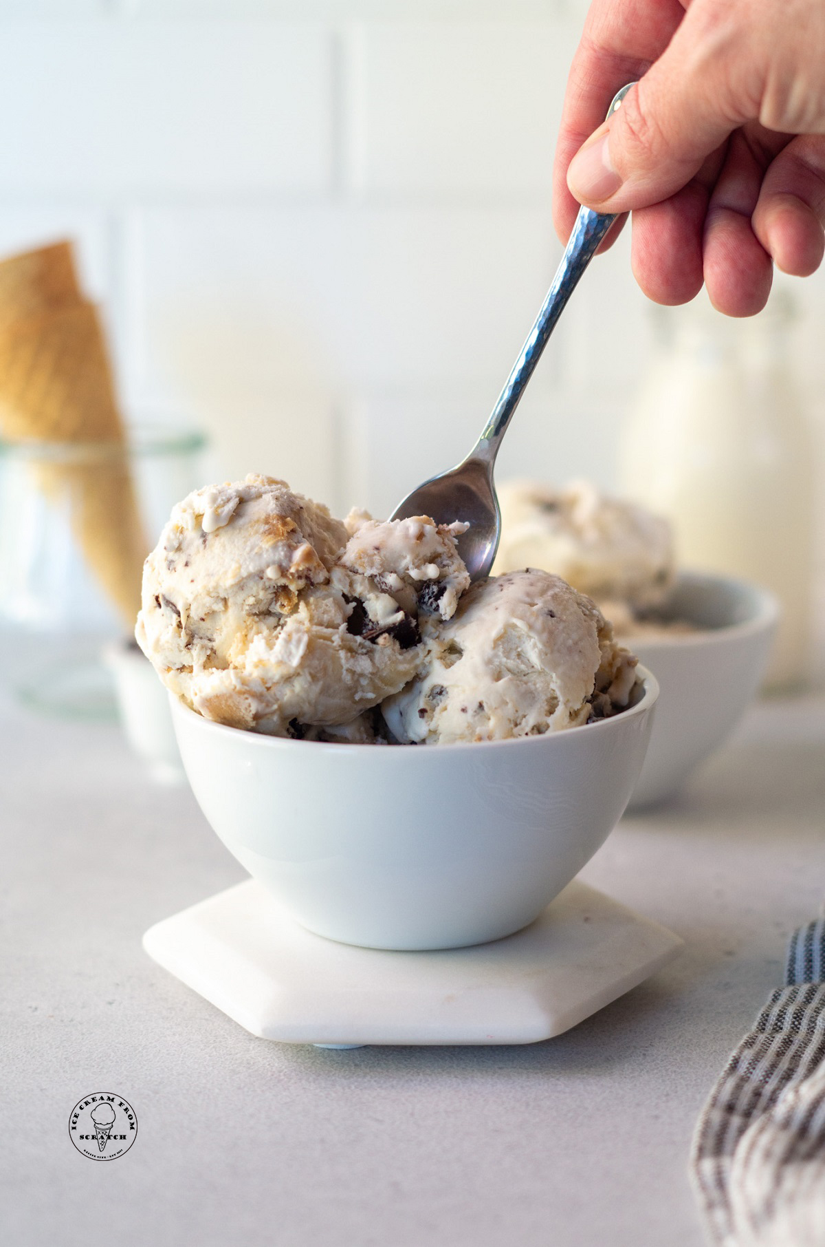 a bowl filled with scoops of peanut butter banana fat elvis ice cream.