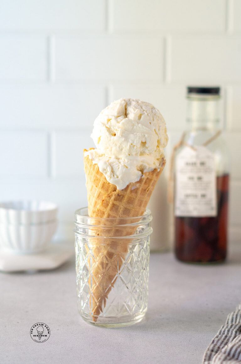 a sugar cone filled with scoops of mexican vanilla ice cream.