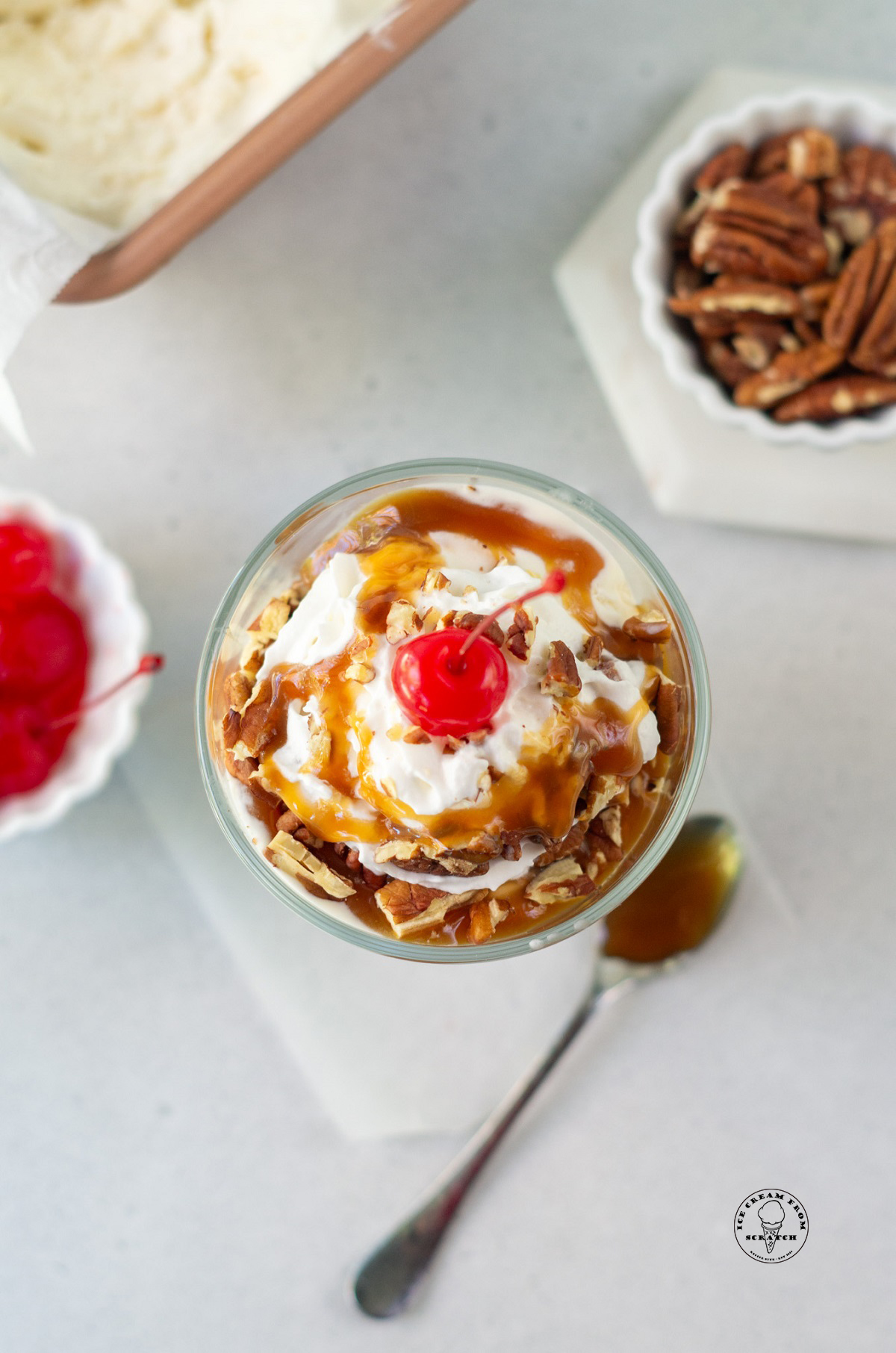 homemade caramel nut sundae, viewed from above.
