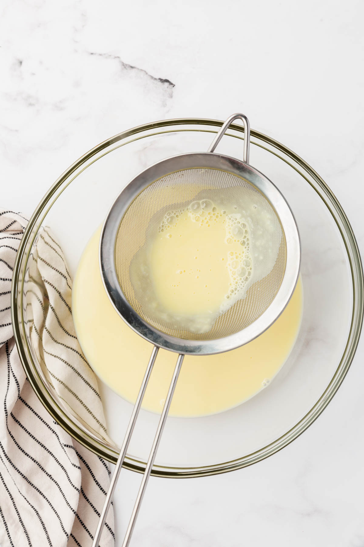 filtering out any chunks from the custard