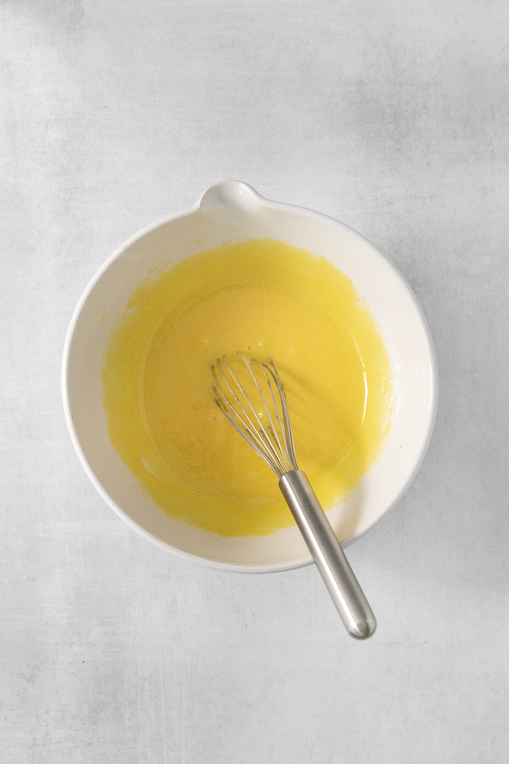 egg, sugar, cream mixed in a bowl