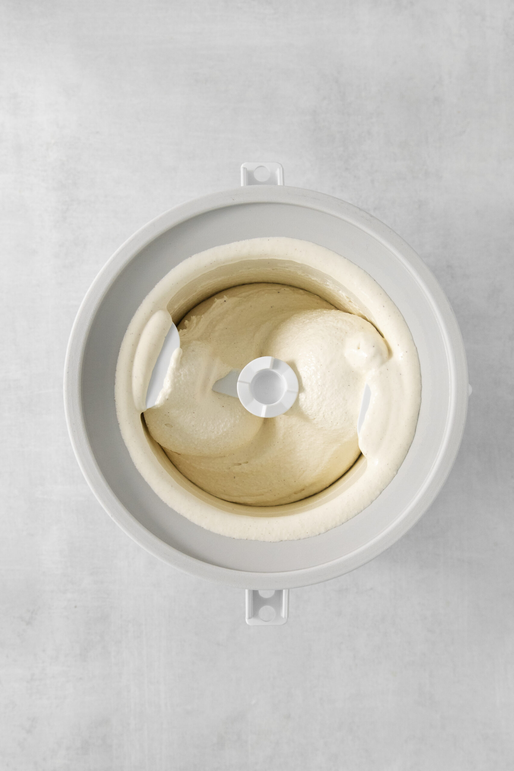 Baklava Ice Cream ingredients in a ice cream maker bowl