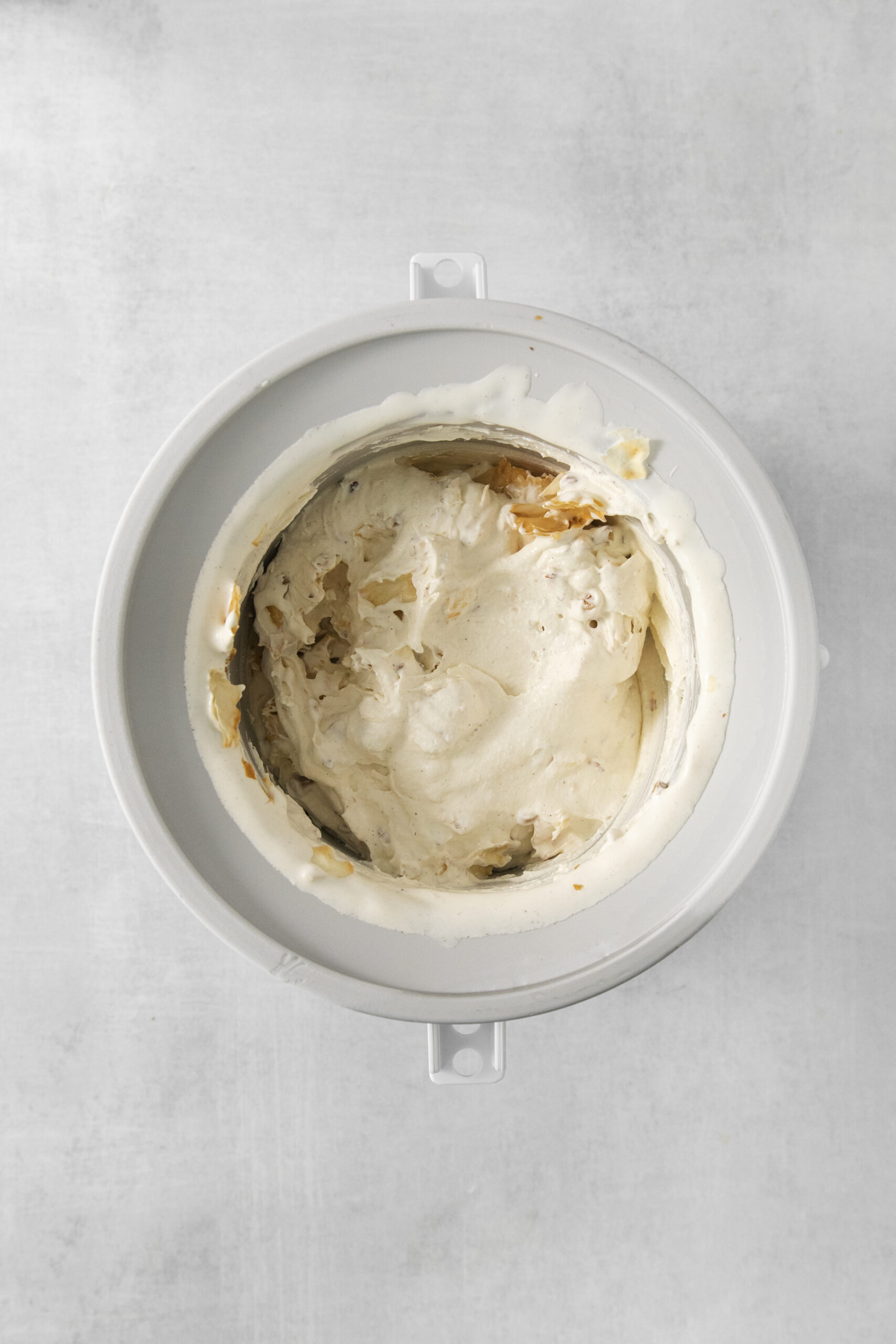 baklava ice cream mixture in a ice cream machine bowl