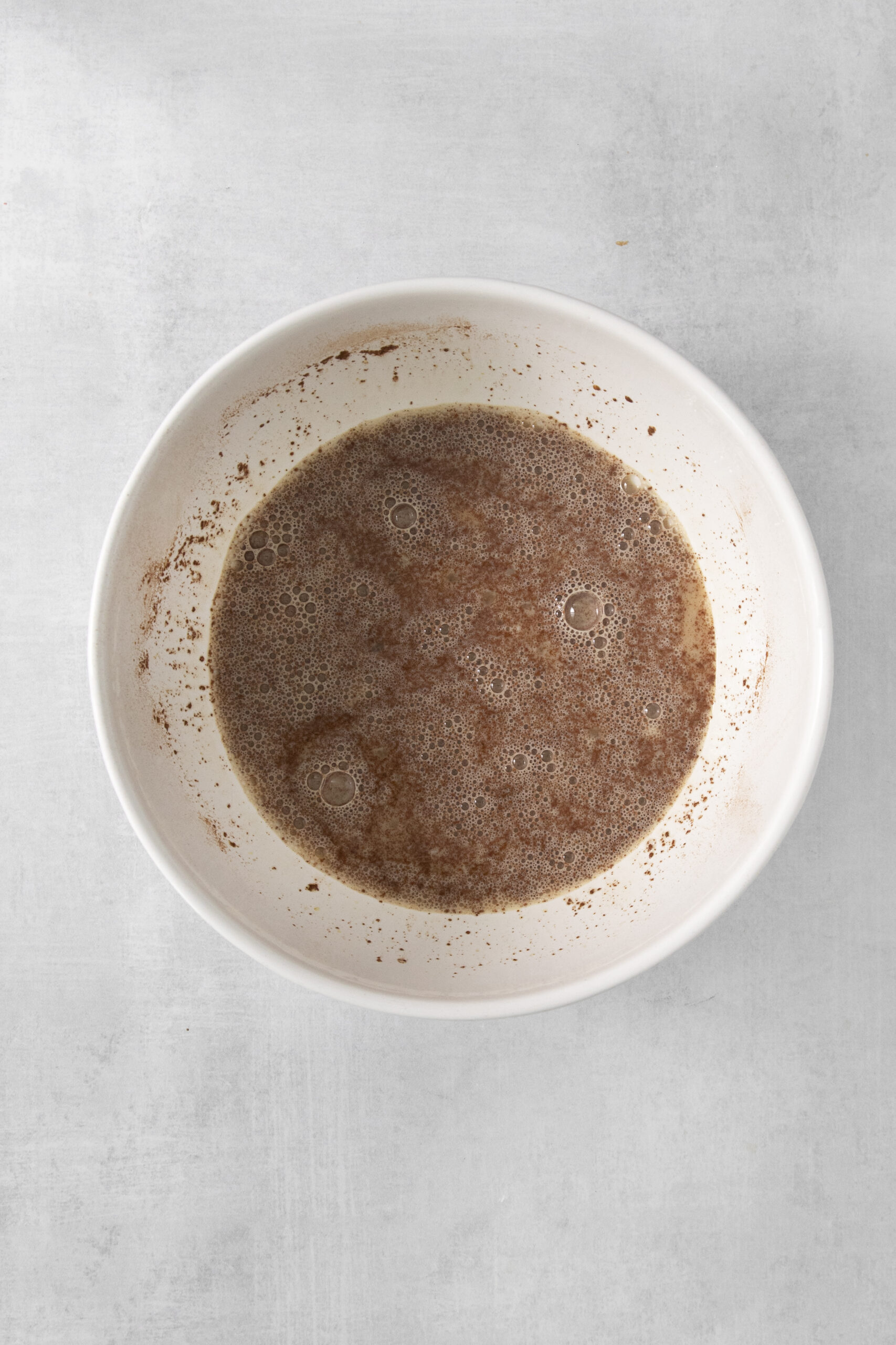 eggs, milk, cinnamon, banana mixed in a bowl