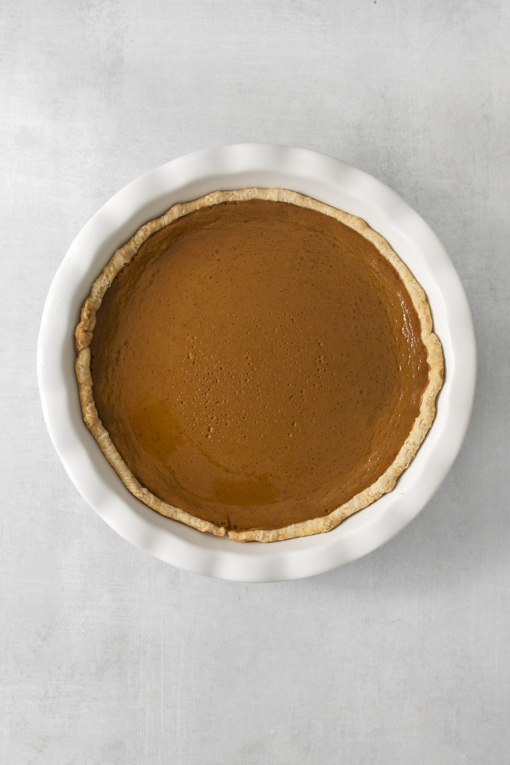 baked pumpkin pie in a pie pan