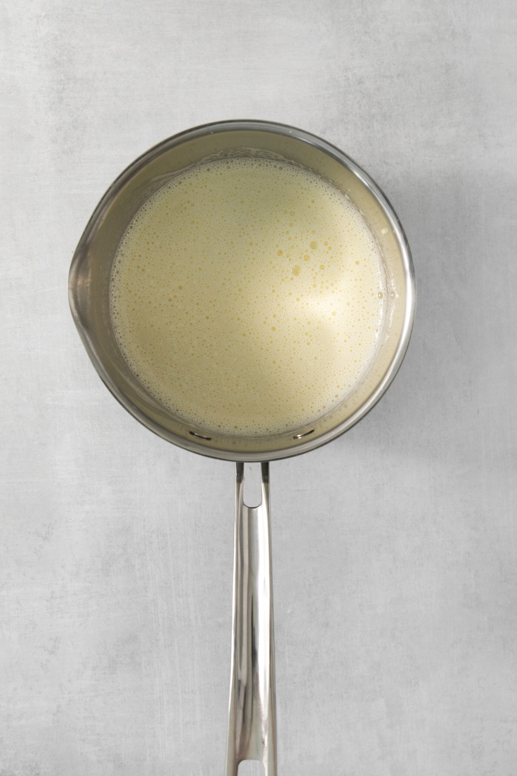 milk heating up in a pan