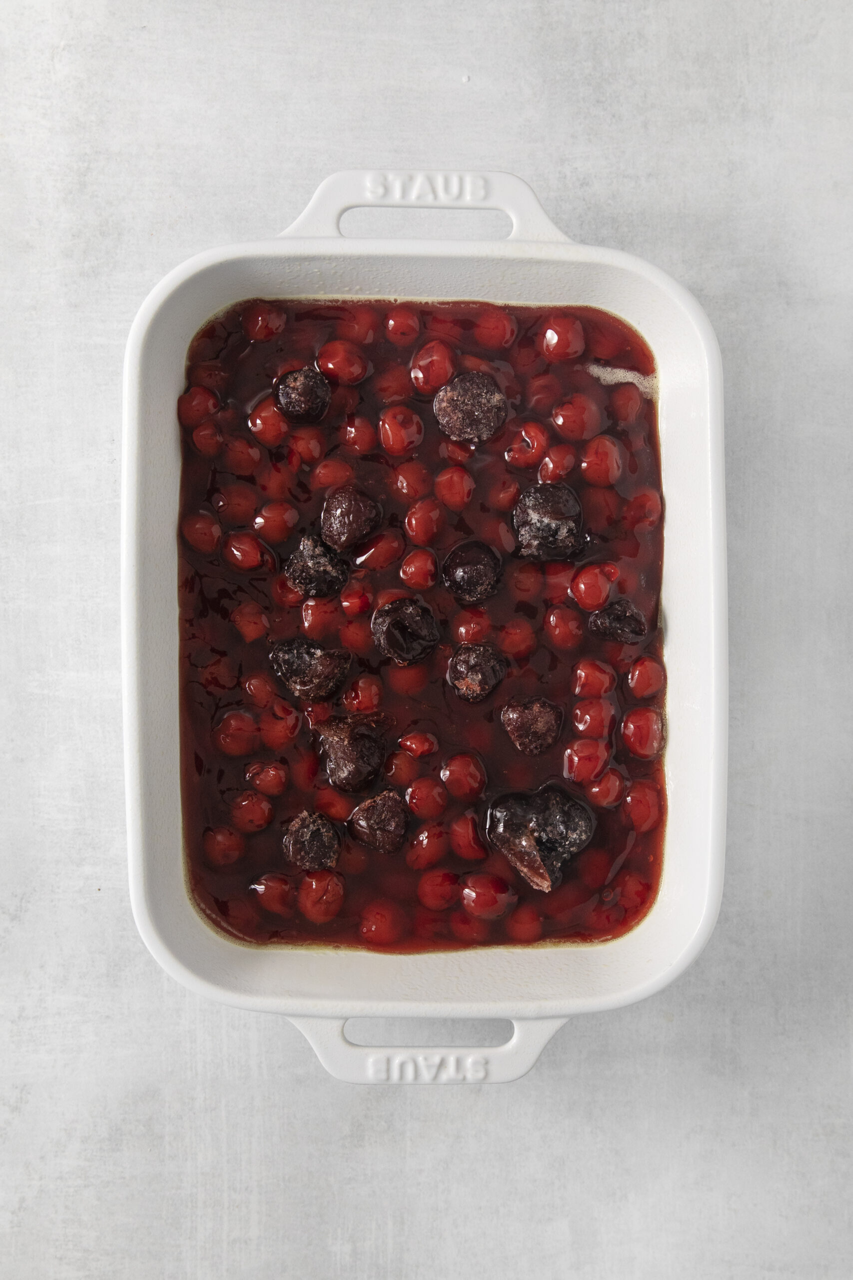 cherry pie filling in a white baking dish