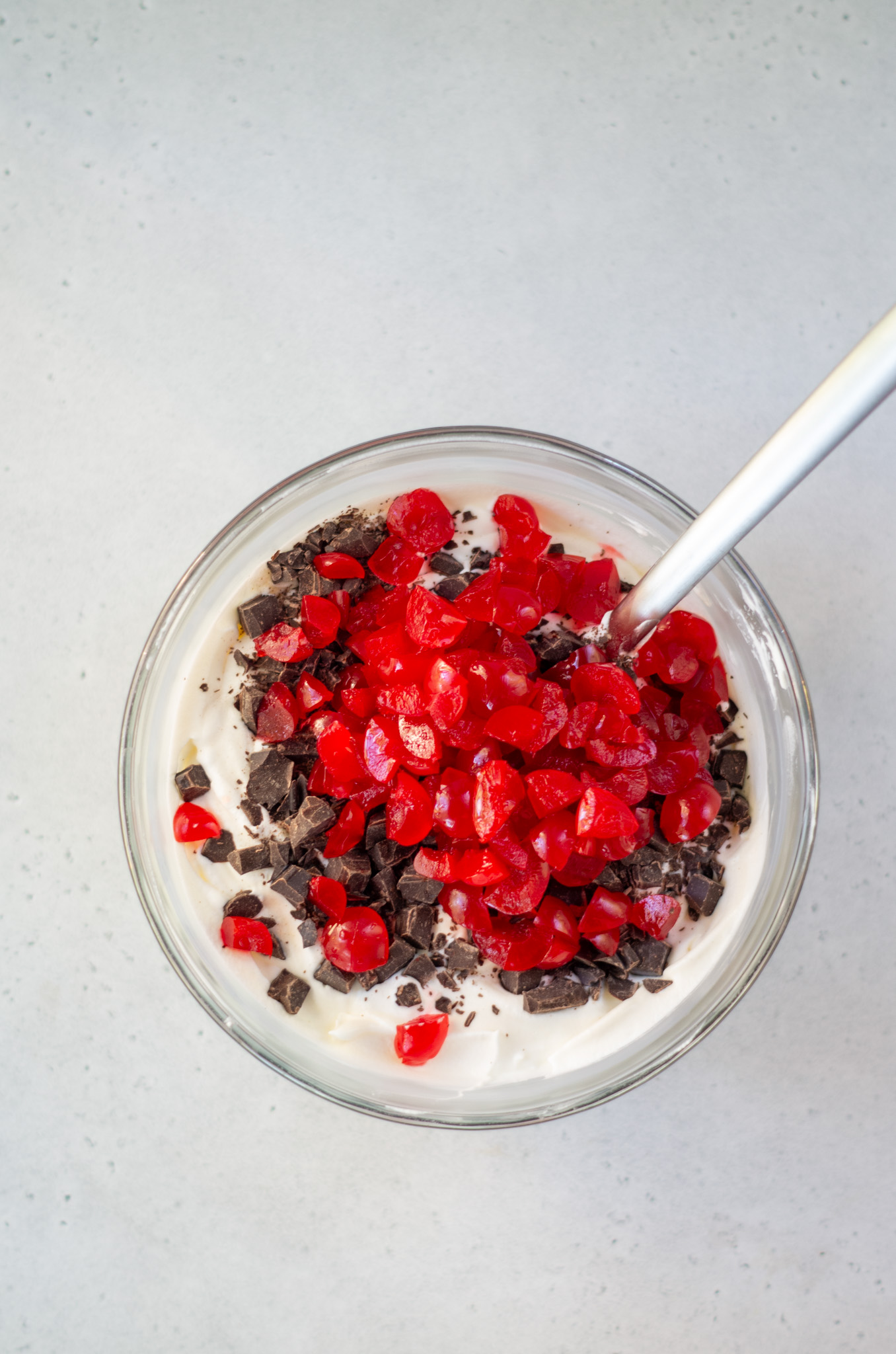 ingredients for cherry cordial ice cream in a bowl