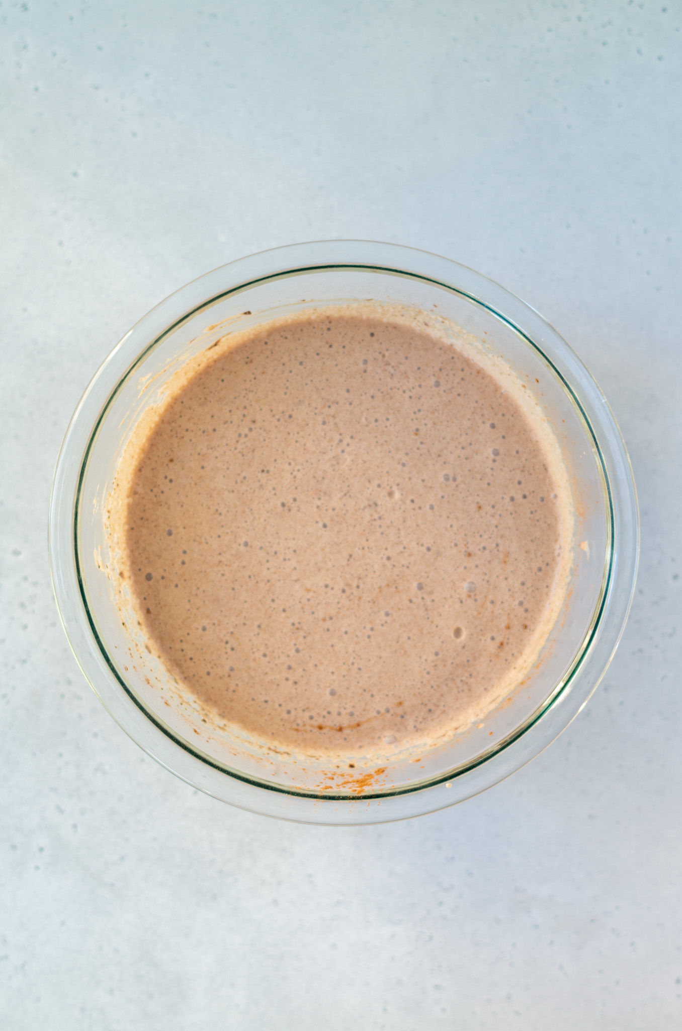 cocoa, cream, milk, salt, vanilla mixed in a bowl