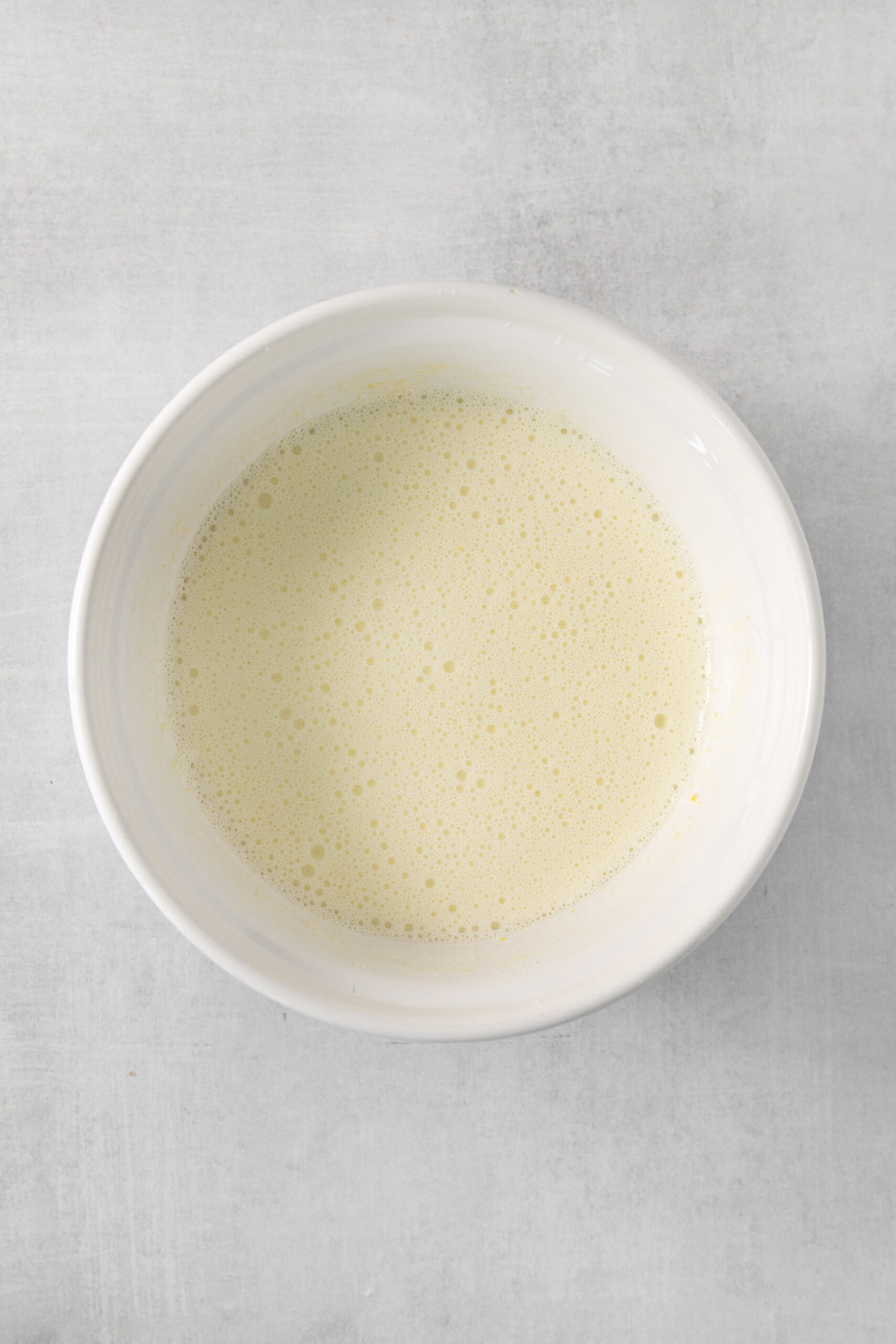 warm milk in a bowl to make the custard