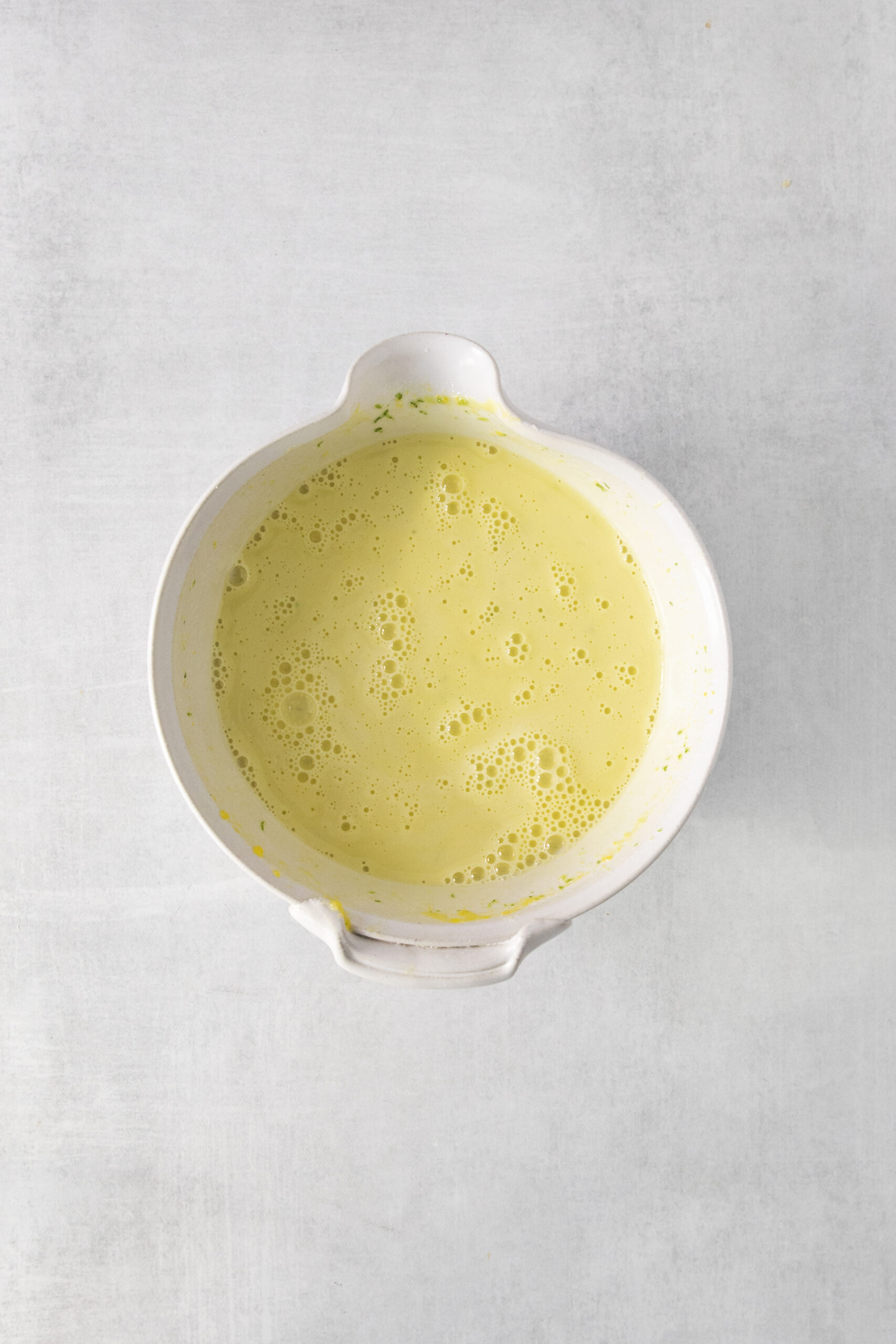 lime ice cream mixture in a mixing bowl
