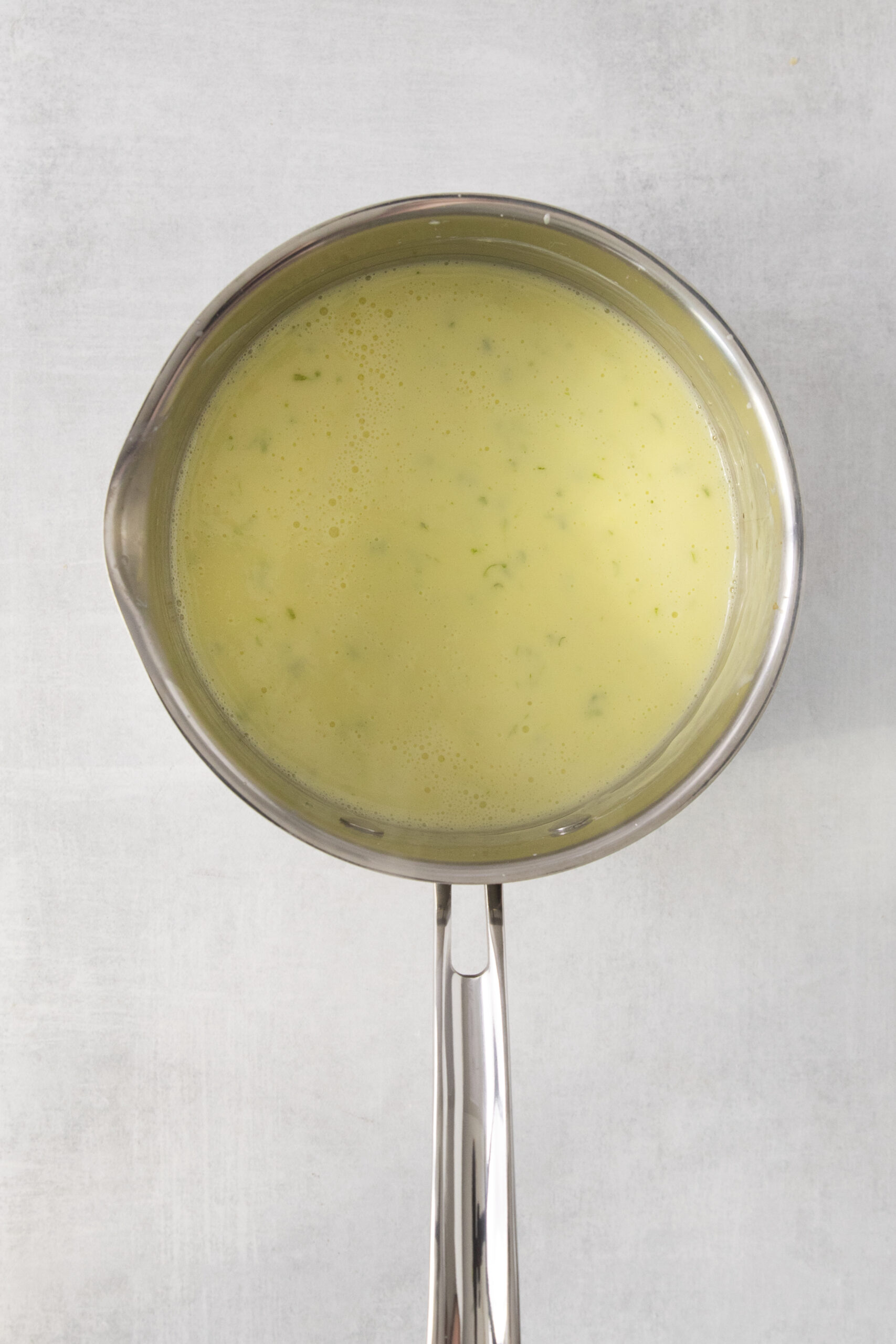lime zest and milk mixture in a pan to heat